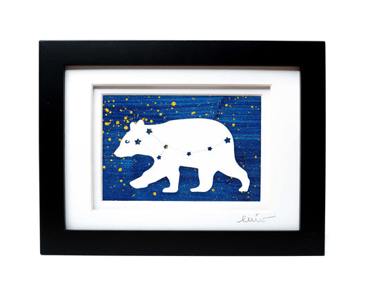 White Ursa Major bear constellation papercut on hand painted dark blue splatter background.