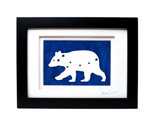 White Ursa Major bear constellation papercut on hand painted dark blue background.