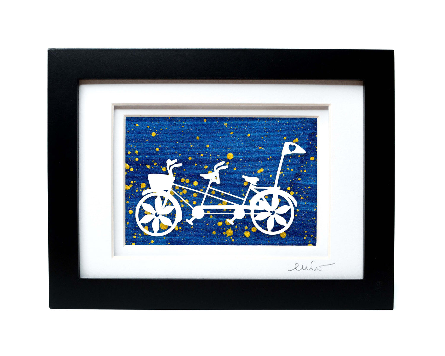 White tandem couples bike with heart flag papercut on hand painted dark blue splattered background.