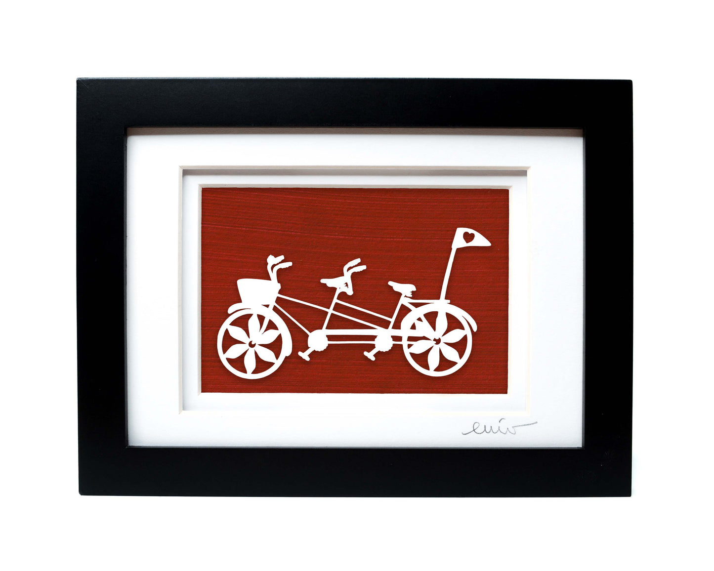 White tandem couples bike with heart flag papercut on hand painted red background.
